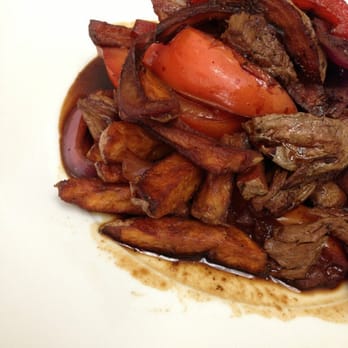 Culantro Peruvian Cookery - Lomo saltado - skirt steak, tomatoes, onions, french fries in a soy & red wine sauce - Peruvian Near Me - Hamilton, Ontario Culantro Peruvian Cookery - Lomo saltado - skirt steak, tomatoes, onions, french fries in a soy & red wine sauce - Peruvian Near Me - Hamilton, Ontario