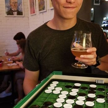 Lamplighter Brewing Broadway - Mid blink and playing his first game of Othello! - Breweries Near Me - Cambridge, Massachusetts