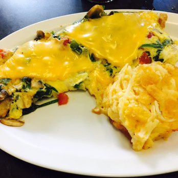 Mel's Diner - Veggie and cheese omelet with spinach and hash brown casserole as a side - Breakfast & Brunch Near Me - Port Orange, Florida Mel's Diner - Veggie and cheese omelet with spinach and hash brown casserole as a side - Breakfast & Brunch Near Me - Port Orange, Florida