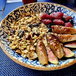 Granola with dogs,  berries and yogurt