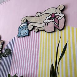 Happy Little Treats - Adorable branding on the wall.