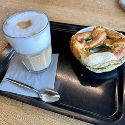 Cream cheese and chive pretzel and latte macchiato Cream cheese and chive pretzel and latte macchiato