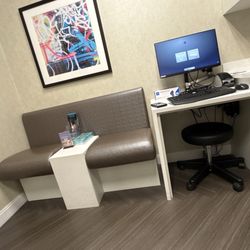 Derick Dermatology - Buffalo Grove - Provider area and seats. Bench table could use a clean. Room2