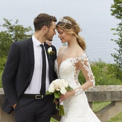 The Lily Mae Bridal Boutique - Wedding gown featuring delicate long sleeves, and an illusion bodice beaded with crystal and pearl.