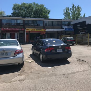 Roti Lady - two cars parked in a parking lot - Indian Near Me - Scarborough, Ontario Roti Lady - two cars parked in a parking lot - Indian Near Me - Scarborough, Ontario