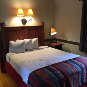 The Lodge at Bryce Canyon - One of the two full beds in our cabin. Convenient overhead lights for reading - Bed & Breakfast Near Me - Bryce, Utah The Lodge at Bryce Canyon - One of the two full beds in our cabin. Convenient overhead lights for reading - Bed & Breakfast Near Me - Bryce, Utah