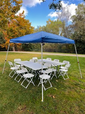 Pop up Canopy, Tables, and Chairs. - For this event we setup two 6’ foot tables and 16 chairs under a light duty pop up 10x10 canopy. The customer was pleased with the set up. Pop up Canopy, Tables, and Chairs. - For this event we setup two 6’ foot tables and 16 chairs under a light duty pop up 10x10 canopy. The customer was pleased with the set up.