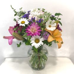 The Flowerhouse - Because we use our own farm grown and locally grown seasonal flowers, each arrangement is unique.