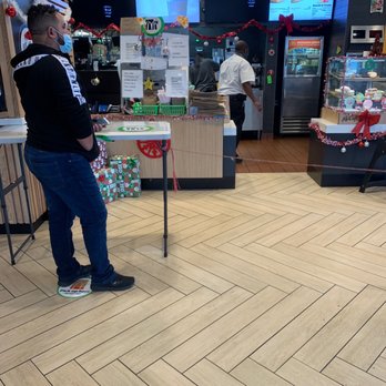 McDonald's - a man standing in front of a counter - Fast Food Near Me - Allentown, Pennsylvania
