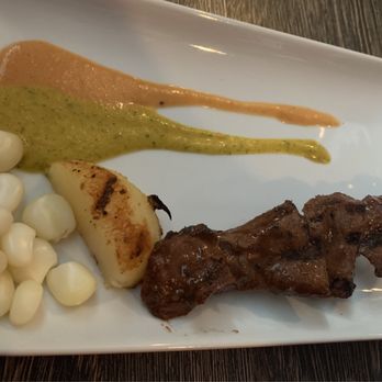 Puerto 511 - Anticucho Grilled Skewers of Veal marinated in aji panka, garlic, cumin, oregano, grilled potato, Peruvian corn, rocoto sauce - Peruvian Near Me - Baltimore, Maryland