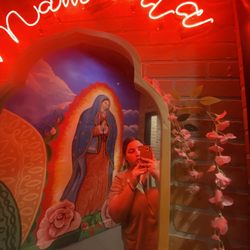 Q’onda taqueria - Me in front of the bathrooms so pretty and funny the sign say "mamacita" 3