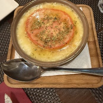 The Venue Steakhouse - Melted Provolone 'Italian Cheese' with Tomato and Oregano - Steakhouses Near Me - Barcelona, B The Venue Steakhouse - Melted Provolone 'Italian Cheese' with Tomato and Oregano - Steakhouses Near Me - Barcelona, B