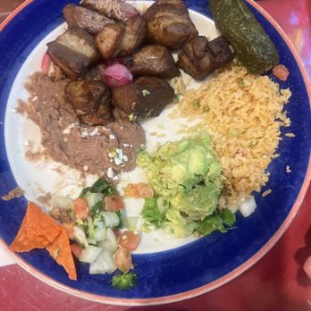 Mi Tierra Cafe & Bakery - Pork  Michoacan plate rice   beans and guacamole - Mexican Near Me - San Antonio, Texas
