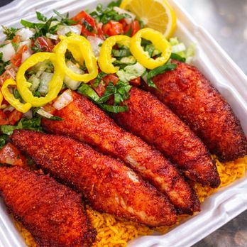 Lakeside Gyros - Vibrant Fish Rice laid on top of golden saffron rice served with side of salad - Mediterranean Near Me - South Saint Paul, Minnesota Lakeside Gyros - Vibrant Fish Rice laid on top of golden saffron rice served with side of salad - Mediterranean Near Me - South Saint Paul, Minnesota