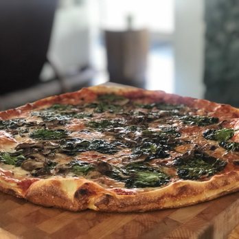 bill's pizzeria - a pizza on a cutting board - Pizza Near Me - Natick, Massachusetts