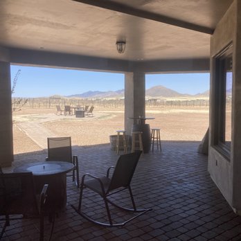 Wilhelm Family Vineyards - a patio with chairs and tables - Wineries Near Me - Elgin, Arizona Wilhelm Family Vineyards - a patio with chairs and tables - Wineries Near Me - Elgin, Arizona