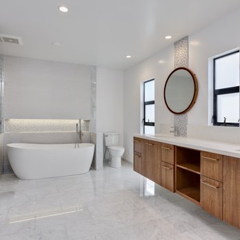 Jamie's Kitchen & Bath - Floating Walnut custom vanity over Carrara marble floor tiles - General Contractors Near Me Jamie's Kitchen & Bath - Floating Walnut custom vanity over Carrara marble floor tiles - General Contractors Near Me