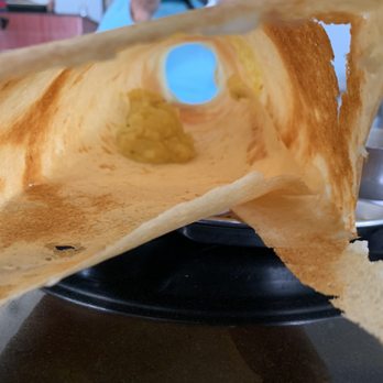 Madras Cafe - Tunnel vision of the Paper masala dosa with that teeny tiny bit of Masala inside - Indian Near Me - Sunnyvale, California Madras Cafe - Tunnel vision of the Paper masala dosa with that teeny tiny bit of Masala inside - Indian Near Me - Sunnyvale, California