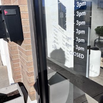 Blue Mind Coffee Roasting - This image is of their hours of operation that's located on their front door - Coffee Roasteries Near Me - Indianapolis, Indiana