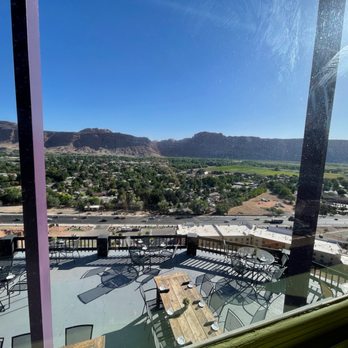 Sunset Grill - Patio and view of Moab from indoor table. - Steakhouses Near Me - Moab, Utah