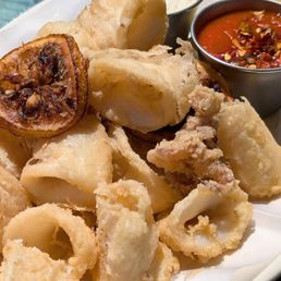Fritto Di Calamari: cut much larger than normal calamari but still tender and crispy on the outside. Fritto Di Calamari: cut much larger than normal calamari but still tender and crispy on the outside.