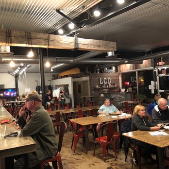 Les Cheneaux Distillers - Fairly busy with just 40 minutes to close. Great decor in here! - Distilleries Near Me - Cedarville, Michigan