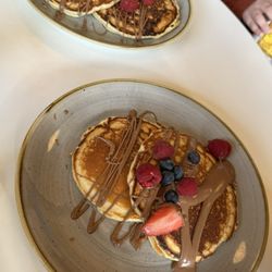 Olive's Room - 2 kids pancakes with chocolate and fresh berries (€5 each). So tasty and fresh