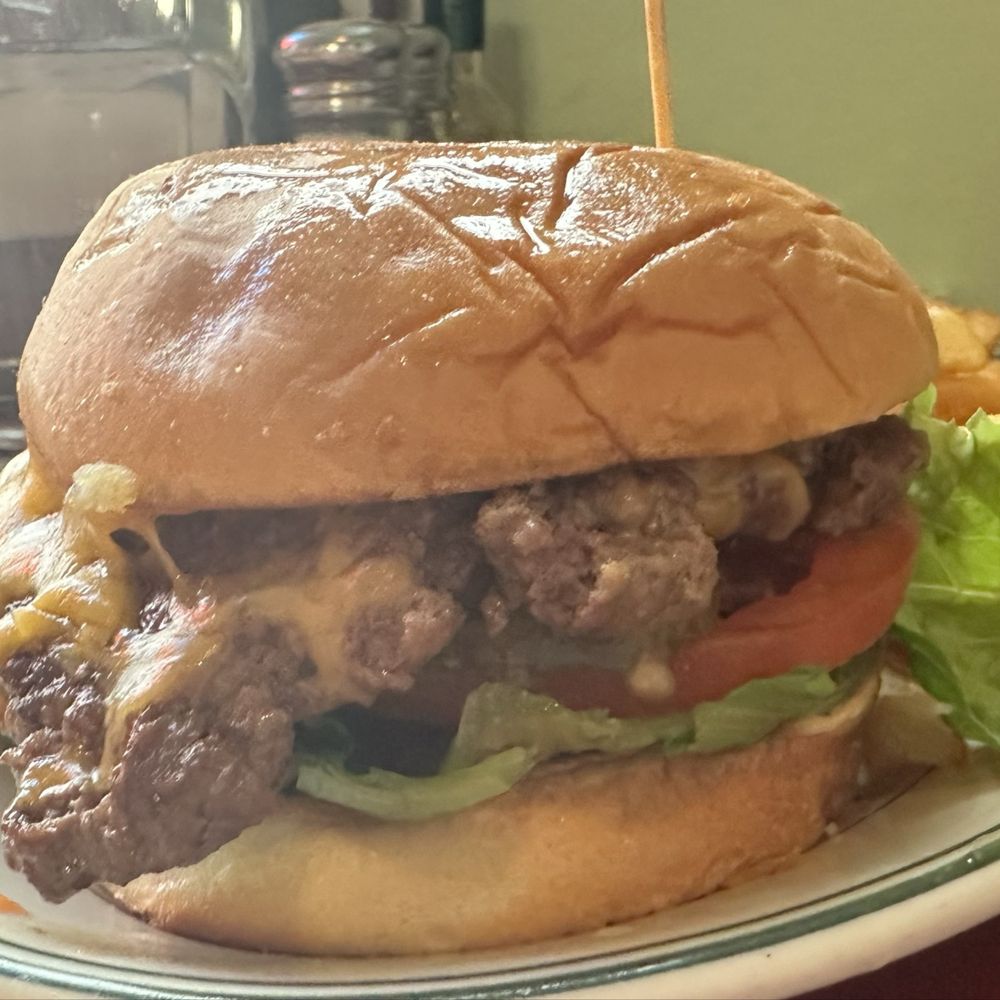 Hogan's Diner - CHEESEBURGER DELUXE Cheddar, crisp lettuce, tomato, pickle and mayo. Grilled or fresh onions upon request. - Diners Near Me - Spokane, Washington Hogan's Diner - CHEESEBURGER DELUXE Cheddar, crisp lettuce, tomato, pickle and mayo. Grilled or fresh onions upon request. - Diners Near Me - Spokane, Washington