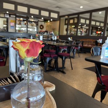 Balkan Taste - a flower in a vase on a table in a restaurant - Modern European Near Me - Mount Prospect, Illinois Balkan Taste - a flower in a vase on a table in a restaurant - Modern European Near Me - Mount Prospect, Illinois