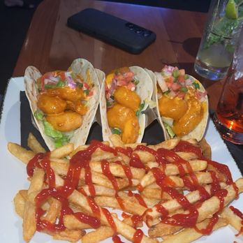 Tommy's Tavern + Tap - Summer Menu: firecracker shrimp tacos with regular fries - American Near Me - Edison, New Jersey