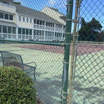 Waccamaw Management - Junky tennis court they refuse to utilize in any fashion. Buckled up and gates locked for a year. A definite eyesore. - Property Management Near Me - Pawleys Island, South Carolina
