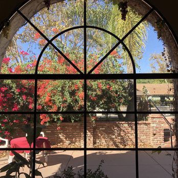 Giessinger Winery - a view of a patio through a window - Wineries Near Me - Fillmore, California Giessinger Winery - a view of a patio through a window - Wineries Near Me - Fillmore, California