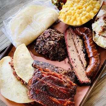 Zavala's Barbecue - Two Sloppy Juan's; Chopped Beef Cheeks; Ribs; Brisket; Pizza Pepper Sausage; Cheesy Jalapeño Hominy; Hill Country Potato Salad - Barbeque Near Me - Grand Prairie, Texas