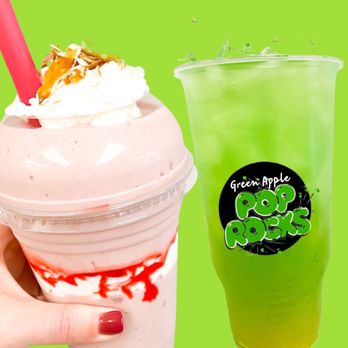 Paint Creek Nutrition - a hand holding a cup of milkshake and a drink - Juice Bars & Smoothies Near Me - Rochester, Michigan Paint Creek Nutrition - a hand holding a cup of milkshake and a drink - Juice Bars & Smoothies Near Me - Rochester, Michigan