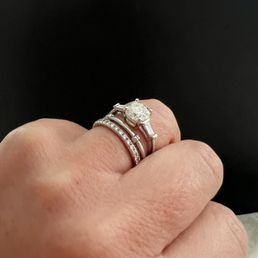 Reset engagement ring solitaire and added baguettes in new setting. Reset engagement ring solitaire and added baguettes in new setting.
