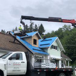 New Creation Renovations - Catching material on the new dormer.