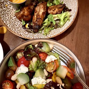 Bouquet Restaurant - Smoked wings with buttermilk and buffalo sauce...and the tomato lovers dream of a salad! - Bars Near Me - Covington, Kentucky