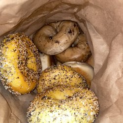 Stuff-A-Bagel - Peak inside our bag of our Baker's dozen bagels... EVERYTHING Bagel, BLUEBERRY Bagel, PLAIN bagel seen.