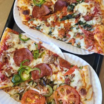 Pizza Mia - two slices of pizza on paper plates - Italian Near Me - Montreal, Quebec Pizza Mia - two slices of pizza on paper plates - Italian Near Me - Montreal, Quebec