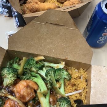 Baji Baji - Front: shrimp & broccoli with pork fried rice, Back: chicken wings with beef fried rice. Food came with a free soda we chose a pepsi - Chinese Near Me - New York, New York Baji Baji - Front: shrimp & broccoli with pork fried rice, Back: chicken wings with beef fried rice. Food came with a free soda we chose a pepsi - Chinese Near Me - New York, New York