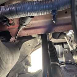 S&K Mufflers, Brakes & More - Disconnected vacuum hose.