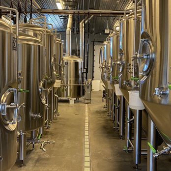 Burning Blush Brewery - a row of stainless steel tanks - Breweries Near Me - Mills River, North Carolina