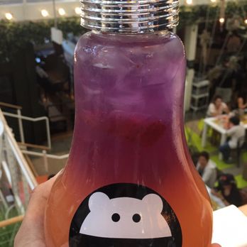Mini Monster Cafe - A look at the sunset strawberry lemonade in a lightbulb glass - Bubble Tea Near Me - Anaheim, California Mini Monster Cafe - A look at the sunset strawberry lemonade in a lightbulb glass - Bubble Tea Near Me - Anaheim, California