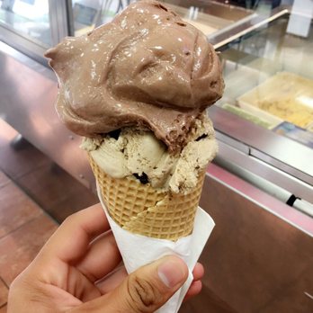 Braums Ice Cream - a hand holding a cone of ice cream - Ice Cream & Frozen Yogurt Near Me - Dumas, Texas Braums Ice Cream - a hand holding a cone of ice cream - Ice Cream & Frozen Yogurt Near Me - Dumas, Texas