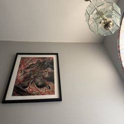 Parthenon Framing & Printing - Framed print hanging on wall.