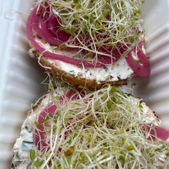 Wise Sons - Garlic bagel with Veg cream cheese, pickled onions and sprouts - Breakfast & Brunch Near Me - Oakland, California Wise Sons - Garlic bagel with Veg cream cheese, pickled onions and sprouts - Breakfast & Brunch Near Me - Oakland, California