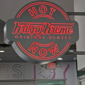 Krispy Kreme - Anotheir of their red lit sign can be seen inside their doughnut shop. - Coffee & Tea Near Me - Roanoke, Virginia