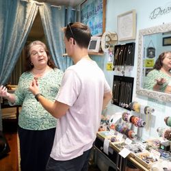 Intuitive Crystals of Danville - Helping a customer. Please go to bottom of picture page to see new items. Thanks.