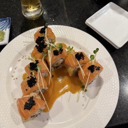 #17 - roll with imitation crab inside and salmon with caviar outside. #17 - roll with imitation crab inside and salmon with caviar outside.