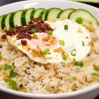 Paolo's Dine-In - a bowl of rice with a fried egg and cucumbers - Filipino Near Me - Calgary, Alberta Paolo's Dine-In - a bowl of rice with a fried egg and cucumbers - Filipino Near Me - Calgary, Alberta